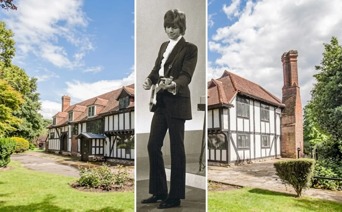 A view of the exterior of Justin Hayward's Coach House, a historic property with classic architectural details.